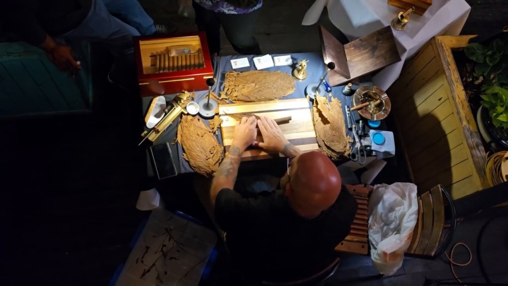 Pirates Cove Cigars rolling cigars by hand during a live cigar rolling event.